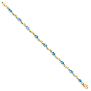 7" 10k Yellow Gold Fancy Diamond and Blue Topaz Bracelet