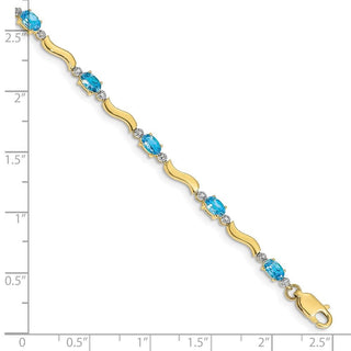 7" 10k Yellow Gold Fancy Diamond and Blue Topaz Bracelet