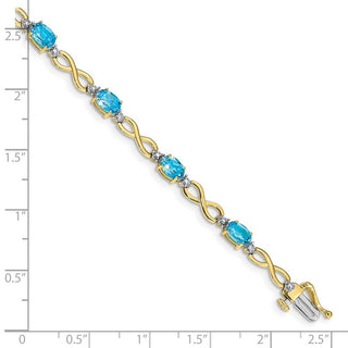 7" 10k Yellow Gold Blue Topaz and Diamond Infinity Bracelet