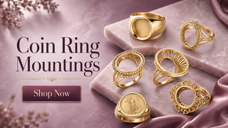 Gold coin ring mountings arranged on rose marble with a Shop Now button for the Coin Ring Mountings collection.