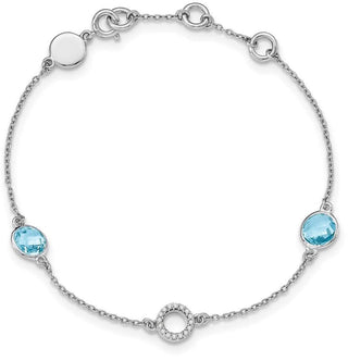 7.25" Sterling Silver White Ice Blue Topaz Station and .05ctw Diamond Bracelet